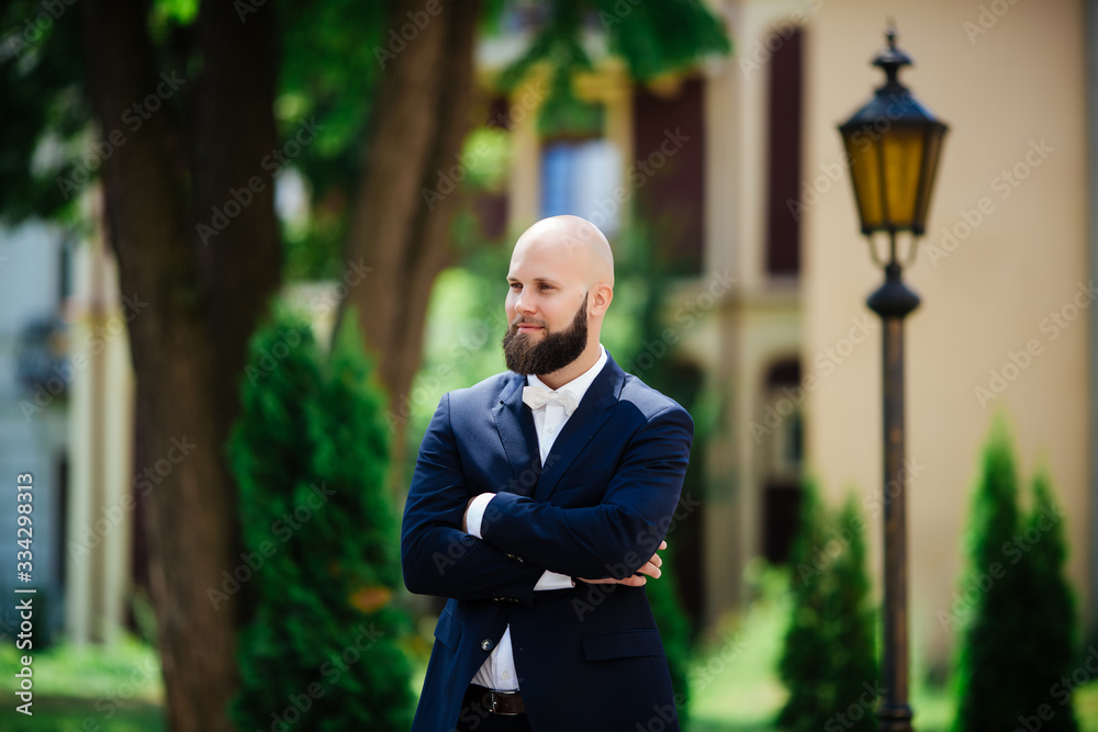 the groom. stands in a jacket. hipster wedding day the groom. stands in a jacket. hipster wedding day
