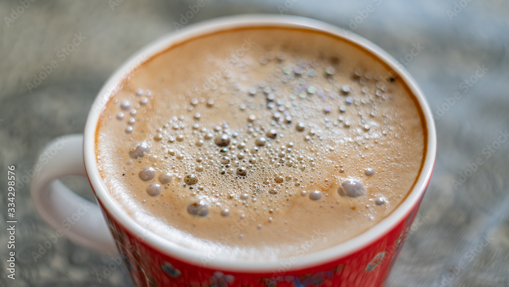 cup of coffee with bubbles on the surface fragment blurred background cup of coffee with bubbles on the surface fragment blurred background