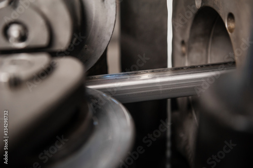 Production of metal products. Pipe forming. Close up © flywish