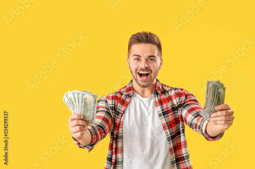 Happy man with money on col...