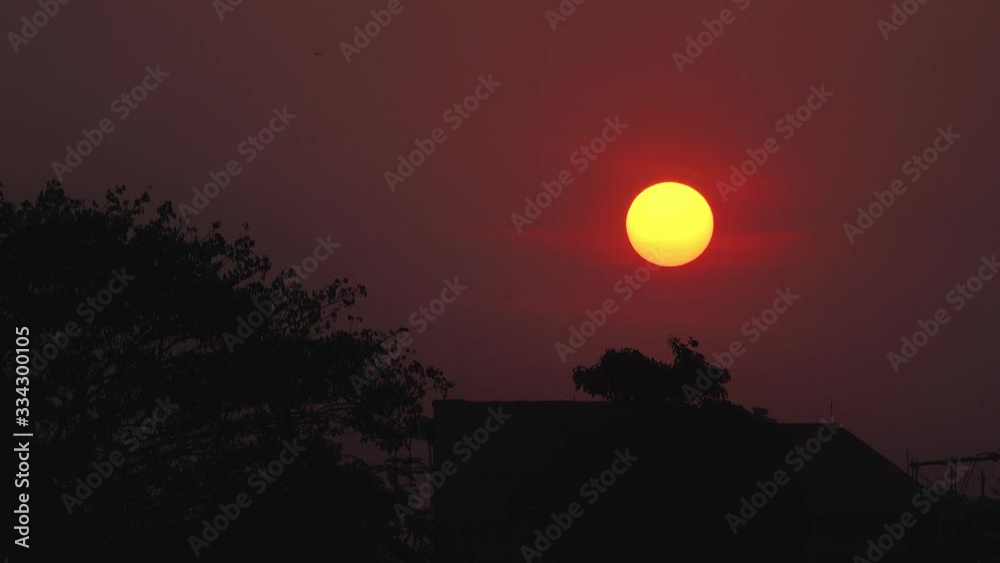 Time Lapse of Circular Sun Setting as the Sky Gets Darker Time Lapse of Circular Sun Setting as the Sky Gets Darker