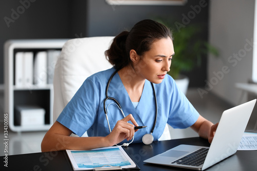 Young female doctor working...