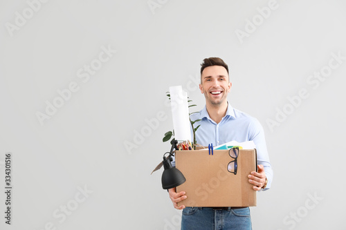 Happy fired man on light ba...