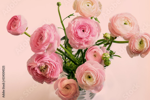 Bouquet of ranunculus pastel pink blossom. Ranunculus asiaticus or Persian Buttercup. Nice greeting card for Mother s Day or Momen s Day. Springtime  holiday greeting.