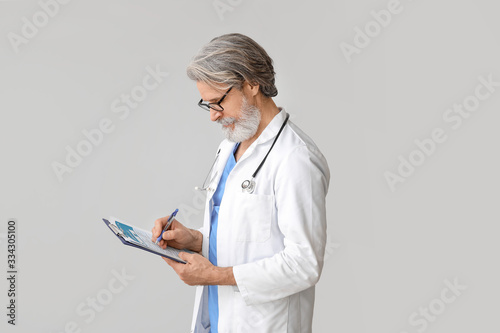 Portrait of senior male doc...