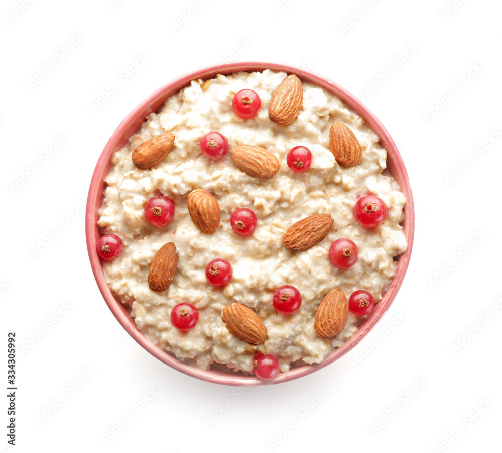 Bowl with tasty sweet oatmeal on white background Bowl with tasty sweet oatmeal on white background