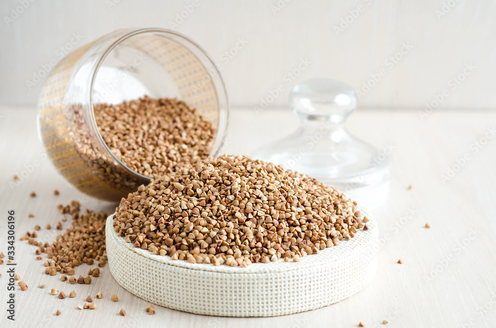 buckwheat stocks on light wooden background. vegetarian food buckwheat stocks on light wooden background. vegetarian food