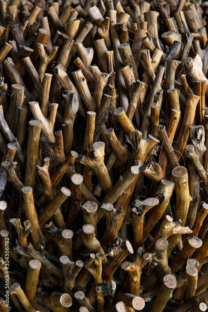 Exactly trimmed cuttings of branches without bark. Composition of wood.