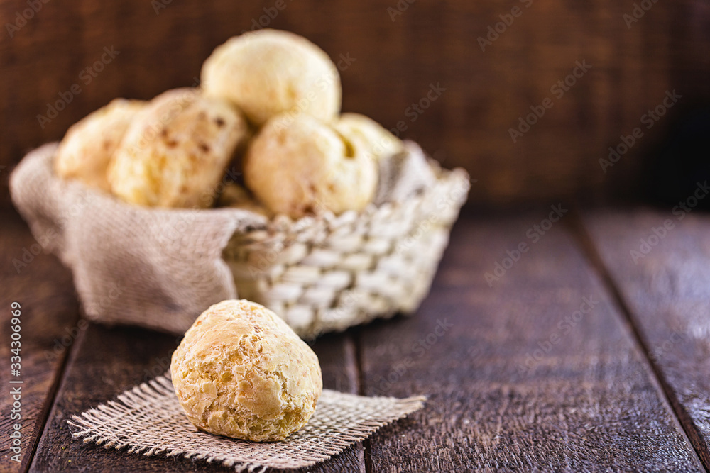 cheese bread made in minas gerais, with selective focus. Rustic background, concept of brazilian cuisine.