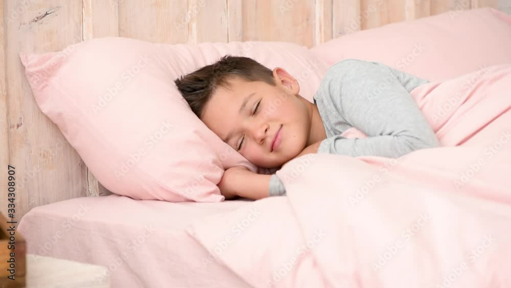 Boy sleeps in his bed, children's emotions Boy sleeps in his bed, children's emotions