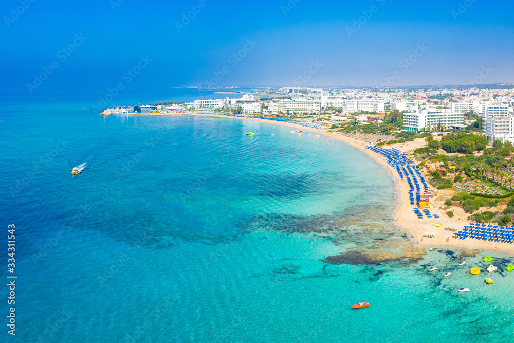 Island of Cyprus. Landscape of the Mediterranean sea. Beach holiday. Boat trips on the Mediterranean sea. Beach infrastructure. Seaside resort. Holidays in Cyprus.