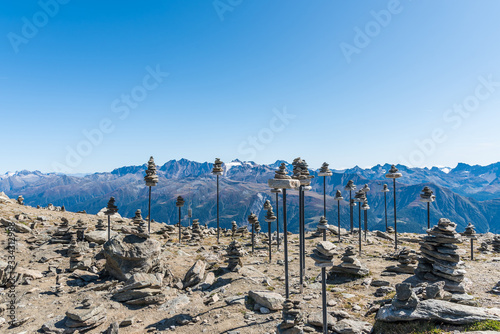 Stone pyramids on a stick. Eggishorn terrace, place of energy and power photo