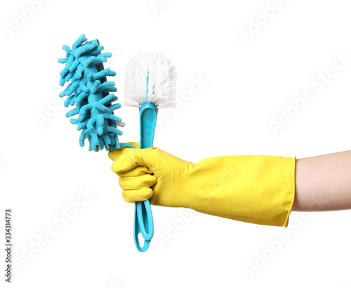 Janitor with cleaning brushes on white background