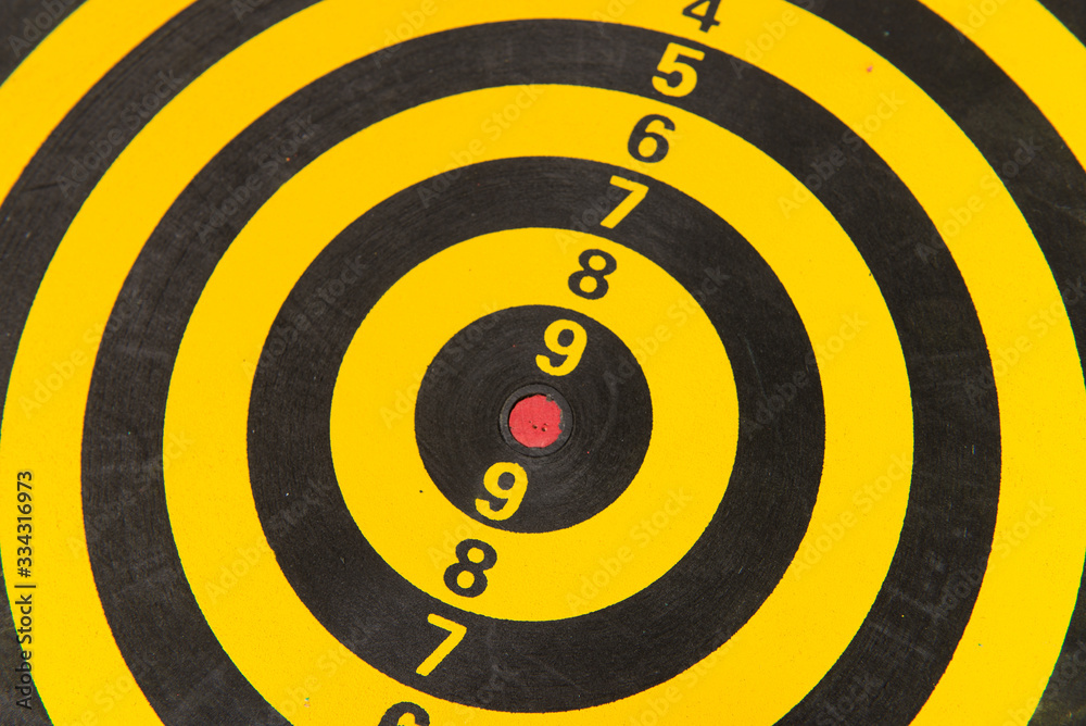 Concept Arrow hitting in the target of dartboard Concept Arrow hitting in the target of dartboard
