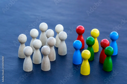 Personal development. Wooden figure in a crowd. Think different.