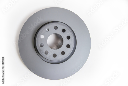 New car brake disc on a white background, close-up. copy-space.