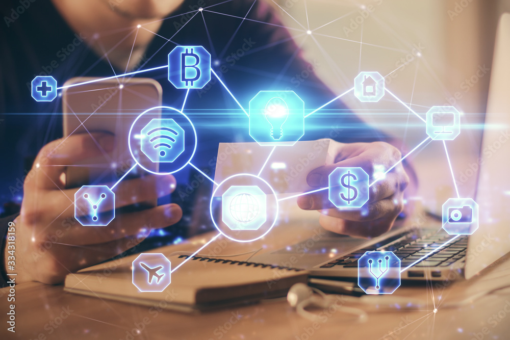 Double exposure of man's hands holding and using a phone and social network theme drawing. Double exposure of man's hands holding and using a phone and social network theme drawing.