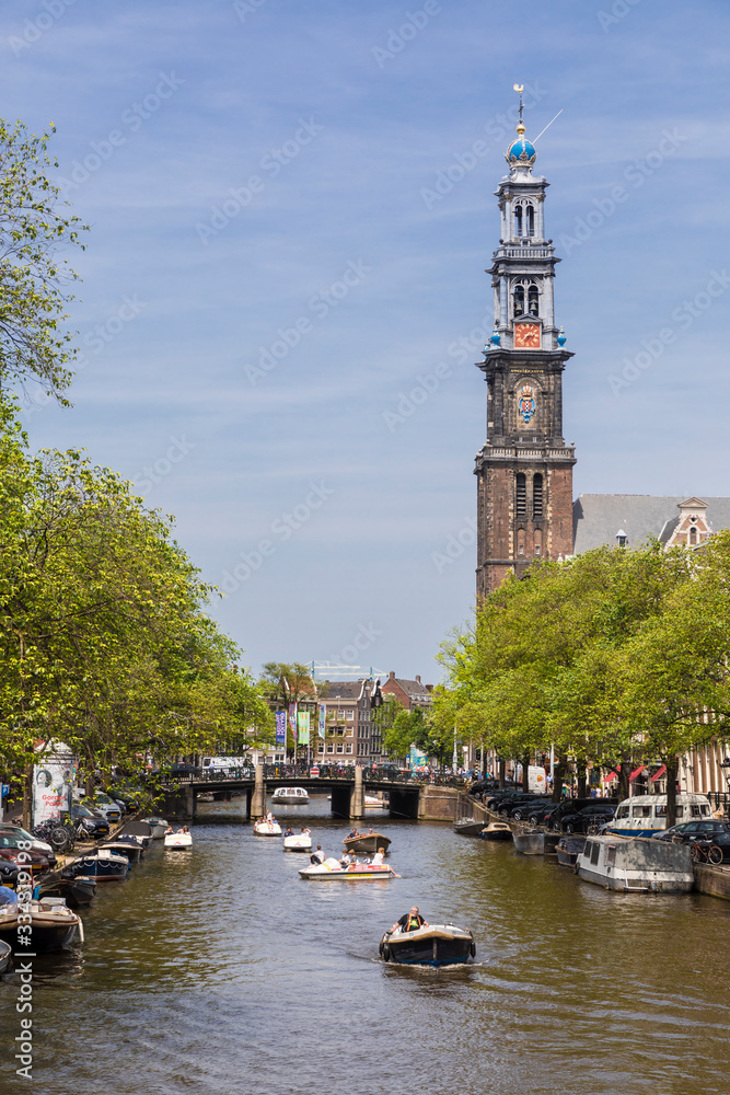 Fototapeta premium Boating on the canals of Amsterdam
