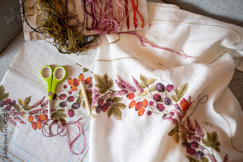 Leipzig, Germany, 03-30-2020 A woman is embroidering a blanket