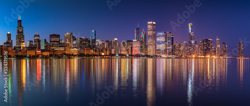 Chicago Skyline Cityscape at night with lake in front and  blue sky with cloud, Chicago, United state. photo