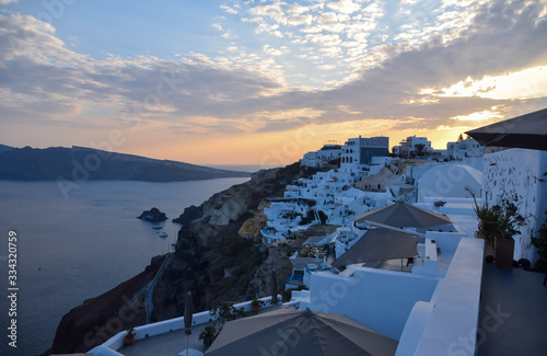 Buildings on the edge of the cliff, in a late afternoon, Oia, Santorini, Greece