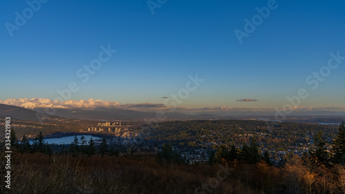 city panorama with snow-capped mountain skyline