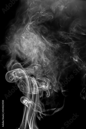 Fototapeta Naklejka Na Ścianę i Meble -  Abstract white smoke animated on a black background