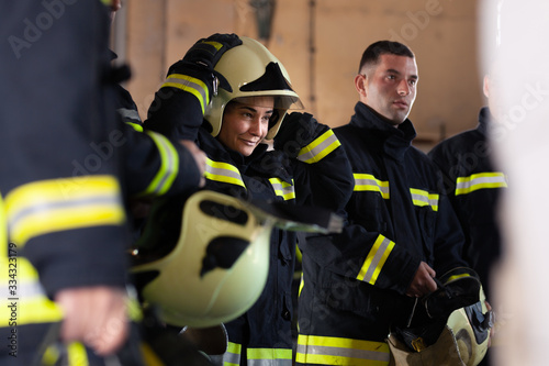 Fotografia Professional firefighters wearing uniforms