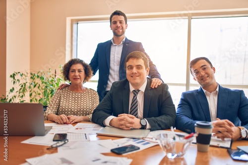 Business lawyers workers meeting at law firm office. Professional executive partners working on finance strategry at the workplace. Smiling happy and cofident to the camera. photo