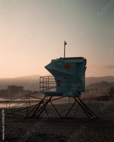 Sunset hitting on lifeguard tower - Ventura Beach, California