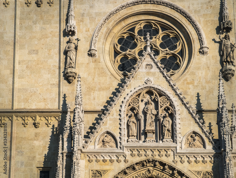 Old famous restored Cathedral of Zagreb in Croatia, fragment of gothic facade with saints statues at main entrance