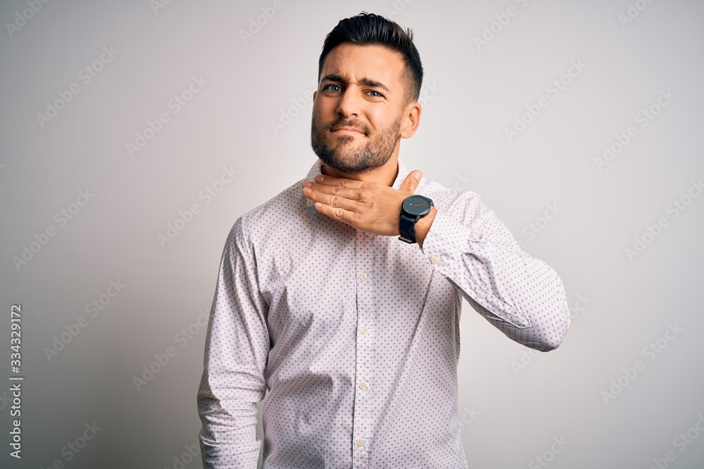 Young handsome man wearing elegant shirt standing over isolated white background cutting throat with hand as knife, threaten aggression with furious violence Young handsome man wearing elegant shirt standing over isolated white background cutting throat with hand as knife, threaten aggression with furious violence