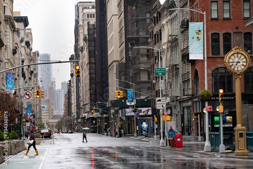 Fototapeta Naklejka Na Ścianę i Meble -  Empty streets of New York City. Madison square garden with historical clock and iron building. Rainy days in new York city, Manhattan. 
