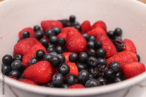 Bluerries  strawberries and blackberries in a bowl