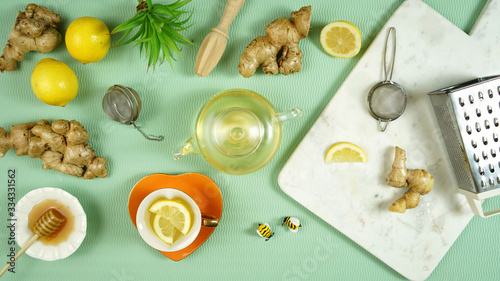 Ginger and lemon herbal tea preparation flat lay  with its high levels of Vitamin C  magnesium and other minerals  ginger root is extremely beneficial for health and boosting the immune system.