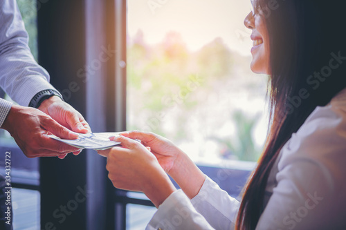 Fotografie Insurance agent offers insurance claim to help insured woman