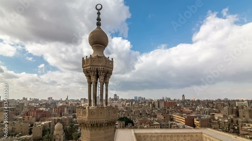 Bab Zuweila gate tower, one of three remaining gates in the walls of the Old city of Cairo, Egypt. City skyline. Time lapse video. photo