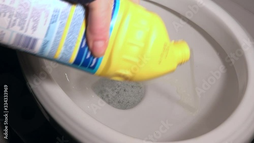 Cleaning a toilet with bleach 4K photo