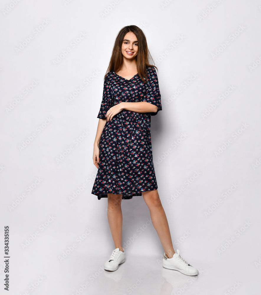 Fashion model wearing black print dress with emotions Fashion model wearing black print dress with emotions