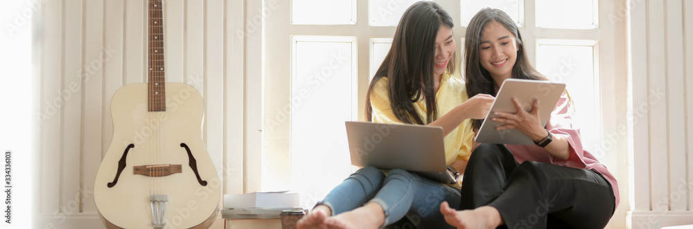 Close up view of two happy music student girls consulting on their upcoming show Close up view of two happy music student girls consulting on their upcoming show
