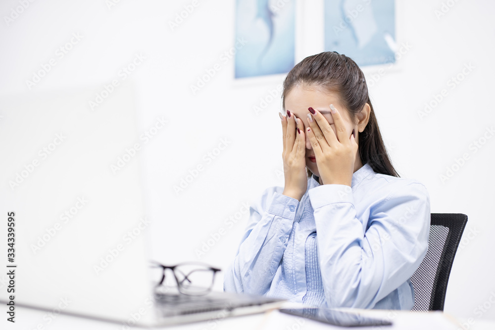 Asian young woman headache and sad depressed in working with friend Encouragement and consolation Asian young woman headache and sad depressed in working with friend Encouragement and consolation