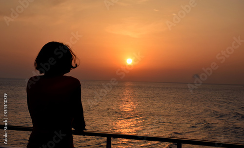 silhouette of woman at sunset