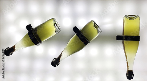 Remuage - collecting sediment in a bottle of champagne by tilting it by 45 degrees. Winemaking, champagne production. photo
