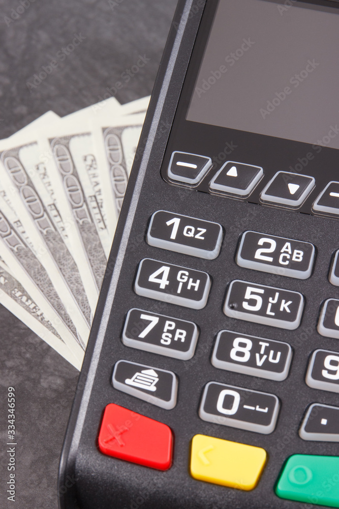 Payment terminal and currencies dollar. Choice between cashless or cash paying in different places Payment terminal and currencies dollar. Choice between cashless or cash paying in different places