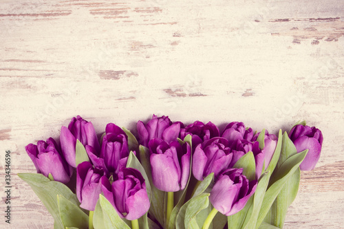 Vintage photo  Bouquet of purple tulips for different occasions on boards  copy space for text