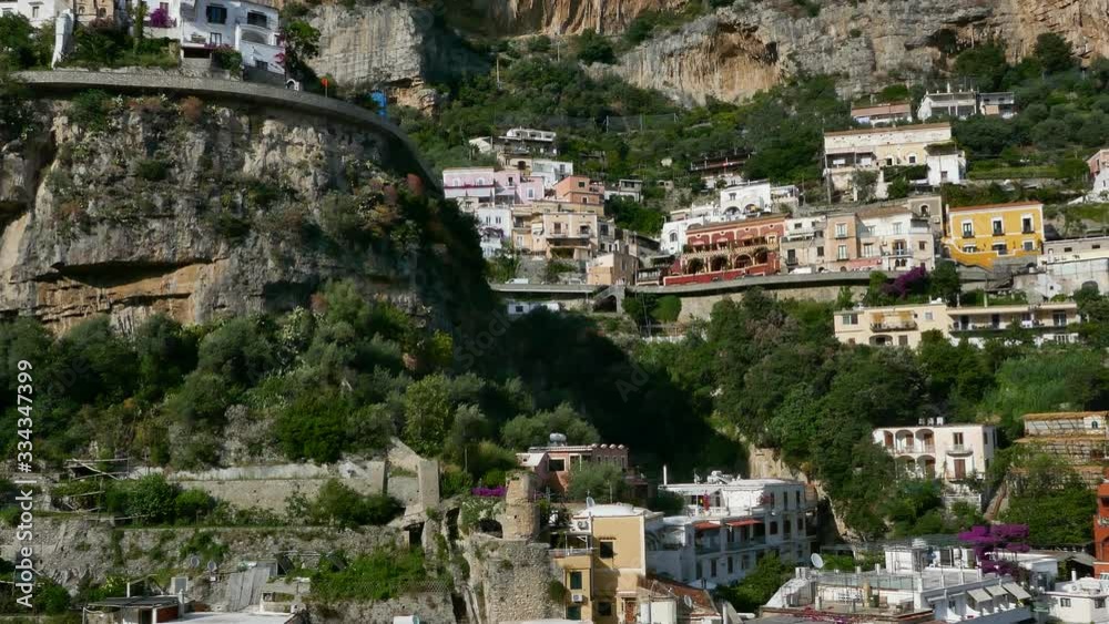 Left to right pan over the colorful buildings of Positano to the sea in Amalfi coast Left to right pan over the colorful buildings of Positano to the sea in Amalfi coast
