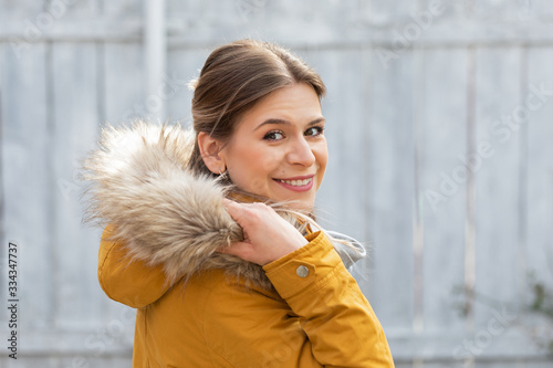 Attractive woman with yellow jacket
