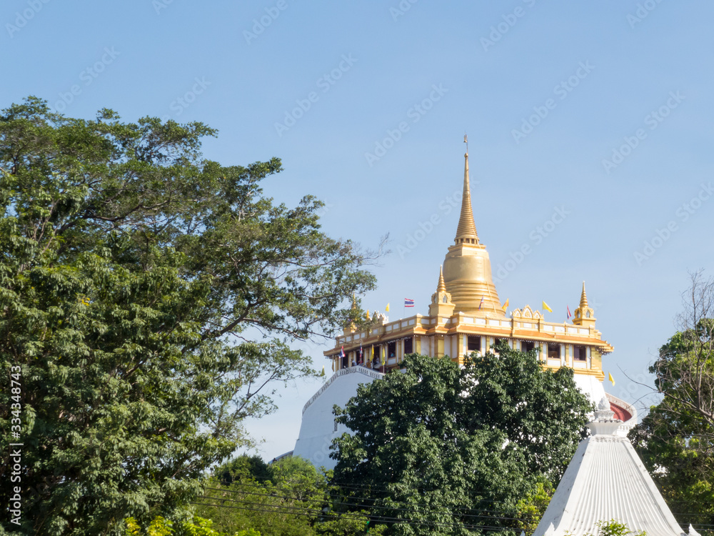 Naklejka premium Golden Mountain (phu khao Tong) Bangkok Thailand The pagoda on the hill in Wat Saket temple.The temple Wat Sa Ket is an ancient temple in the Ayutthaya period.