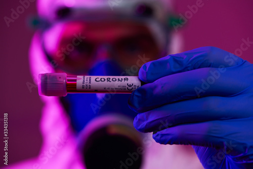 Coronavirus, Doctor holding positive covid-19 virus Blood Sample test tube