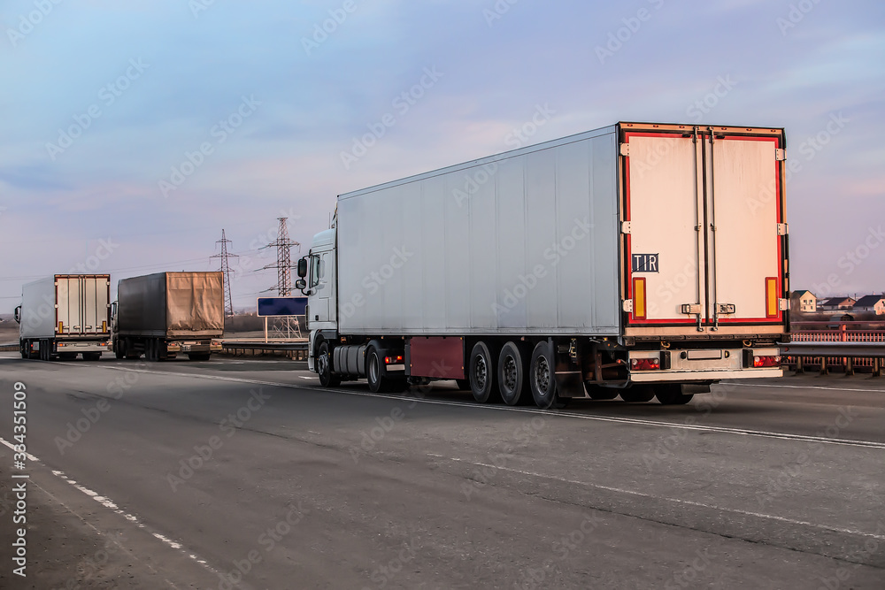 Trucks moving on a suburban highway